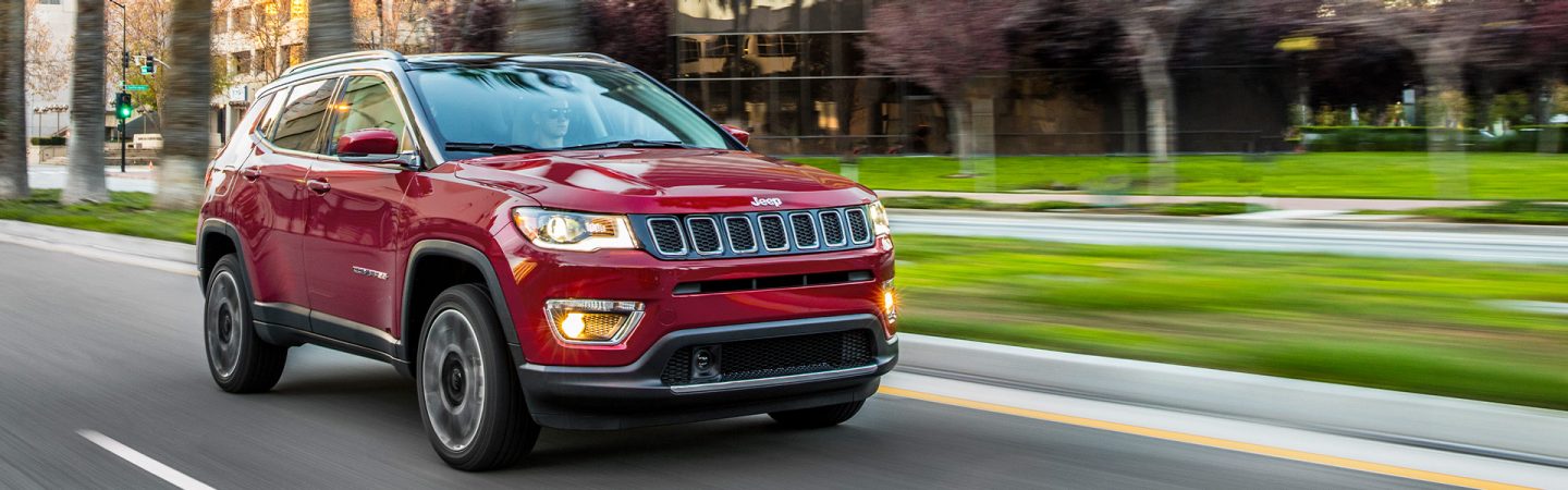 The 2021 Jeep Compass being driven on a city street.