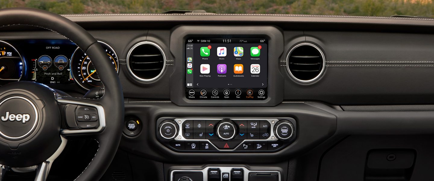 A close-up of the Uconnect touchscreen in the 2021 Jeep Wrangler Sahara.